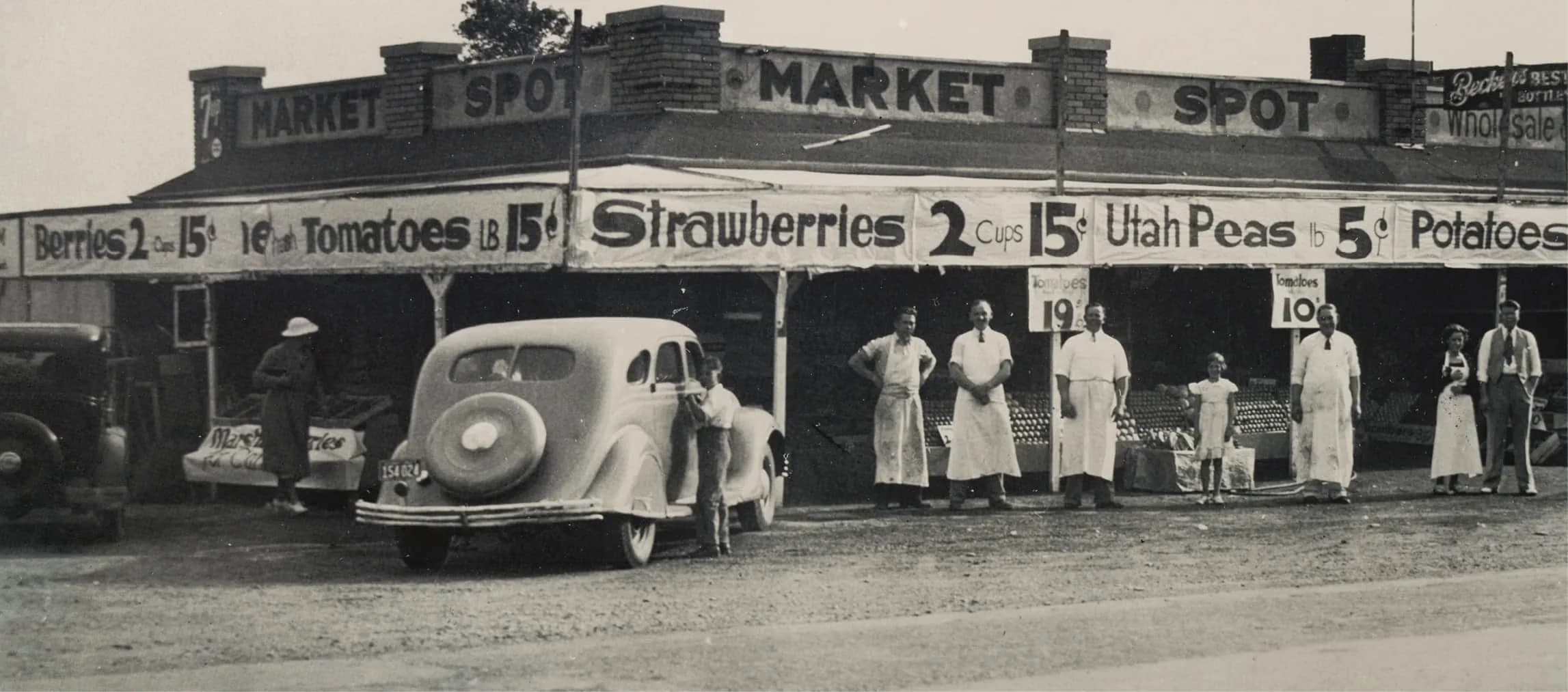 Historic black-and-white photo of the original Harmons market stand from 1932