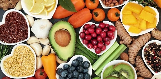 Colorful plant-based produce and prepared dishes